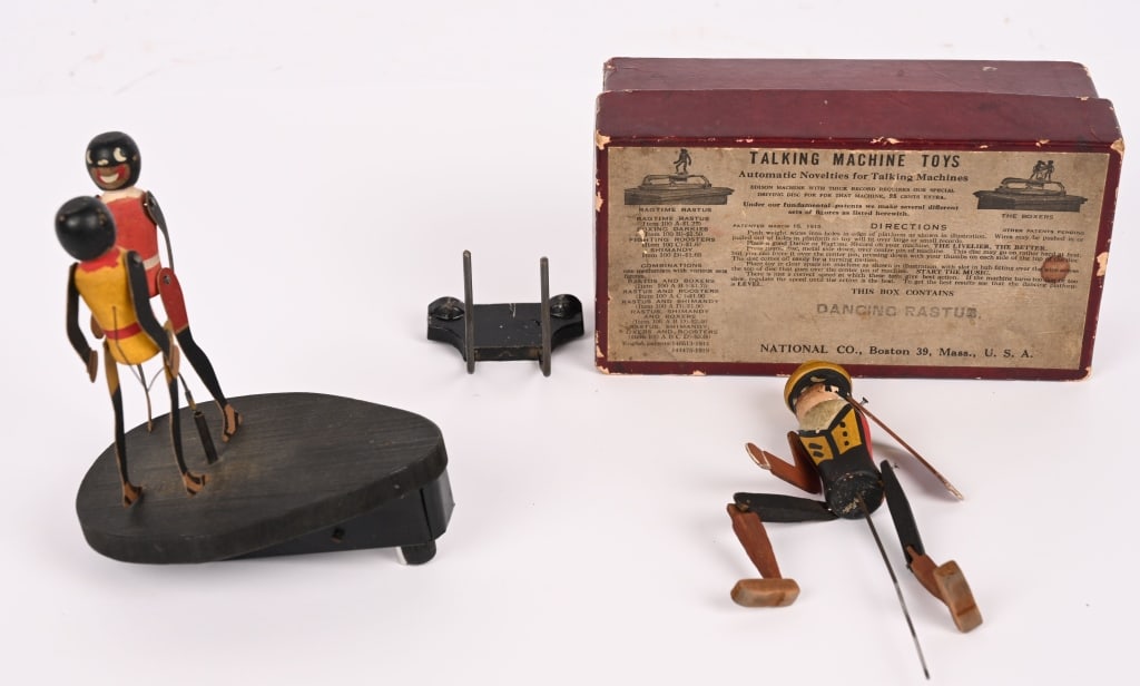 2- NATIONAL CO. TALKING MACHINE TOYS, 1 w/ BOX: Lot of 2 National Co Talking Machine Toys. These were mounted on the top of a phonograph and danced as the music played. The single figure includes the original box. Largest is 5 1/2" Very