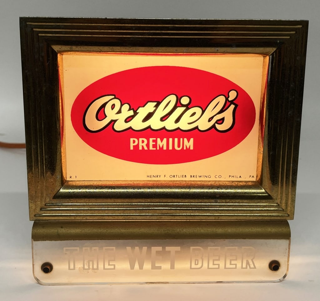 ORTLIEL'S WET BEER LIGHTUP CASH REGISTER SIGN: Ortliel's Wet Beer lightup Cash Register Sign. All original in nice condition. Brewed in Philadelphia, Pennsylvania. Worked when tested. 7 1/2"x7 1/2" Excellent