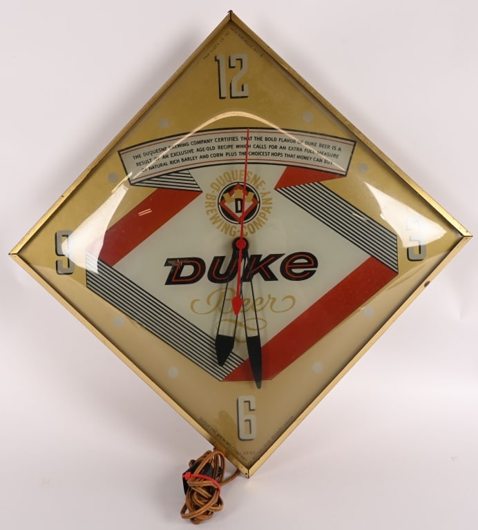 DUKE BEER LIGHTUP PAM CLOCK: Duke Beer lightup PAM Clock. All original in great shape. Has PAM decal on back. Worked when tested. Brewed in Pittsburg, PA. 15" Excellent