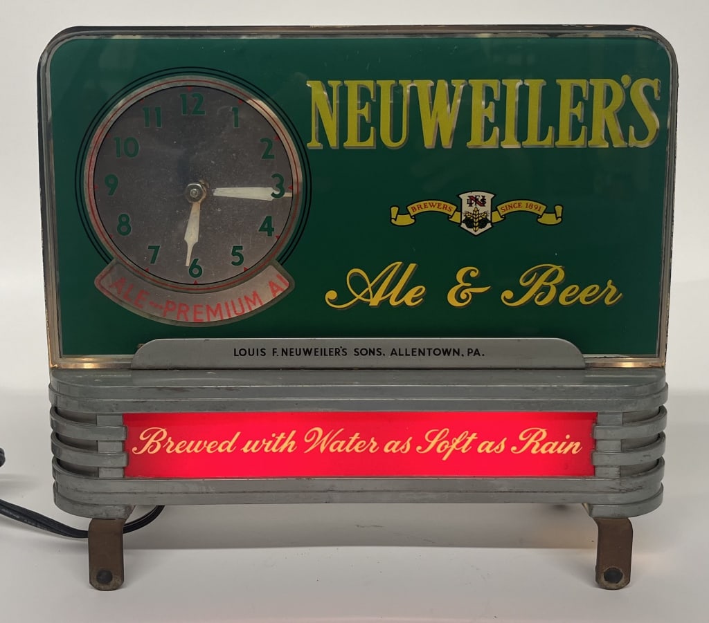 NEUWEILER'S BEER REVERSE GLASS LIGHT UP CLOCK: Neuweiler's Ale & Beer reverse painted glass light up Clock. Has spinning advertisement. All original with great colors. Works well. Still has bottom mounting hardware. Brewed in Allentown, PA.