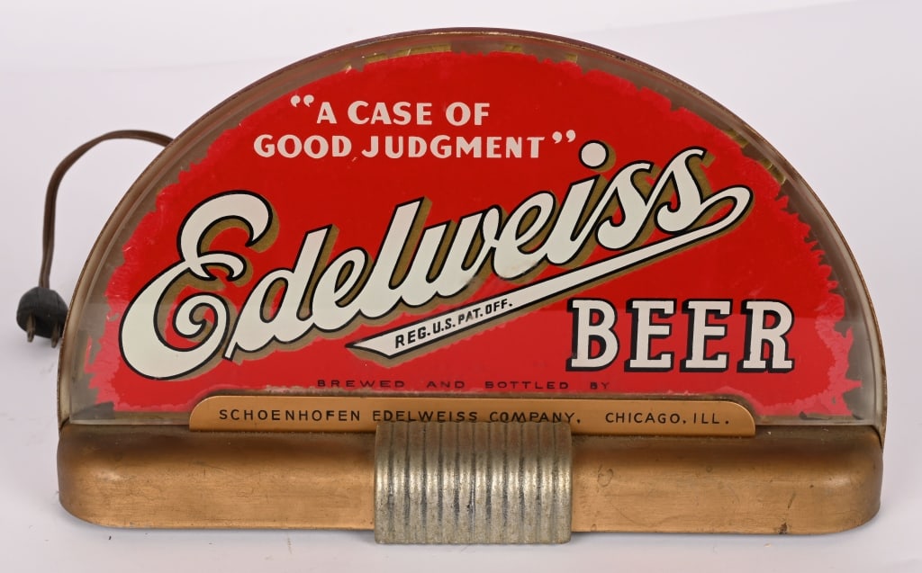 EDELWEISS BEER DECO PRI-BRO LIGHTUP SIGN: Edelweiss Beer deco style Pri-Bro Lightup Sign. All original in nice condition. Has some edge loss. Brewed in Chicago, IL. Worked when tested. 13"x8" Excellent