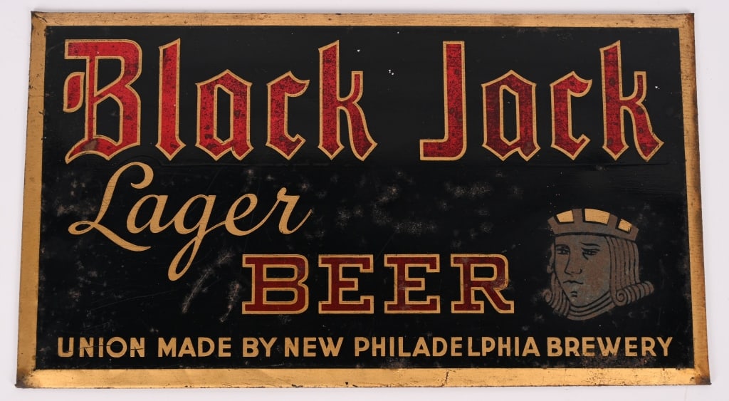 BLACK JACK LAGER BEER TIN SIGN: Black Jack Lager Beer tin over cardboard Sign. Nice graphics. Brewed in Philadelphia, PA. 14"x8" Very Good-Excellent