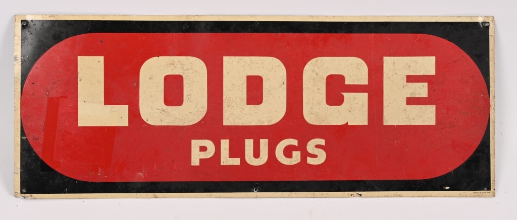 LODGE PLUGS TIN SIGN: SST Lodge Plugs tin Sign. All original condition. Marked Made in England on bottom edge. 24"x9" very Good-Excellent