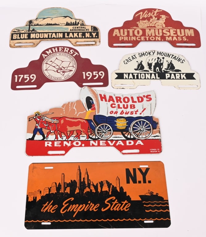 6- LICENSE PLATE TOPPERS: Lot of License Plate Toppers. Includes Blue Mountain Lake NY, Reno Nevada, The Empire State, Princeton Mass, Great Smoky Mountains, and Amherst Mass. Very Good-Excellent