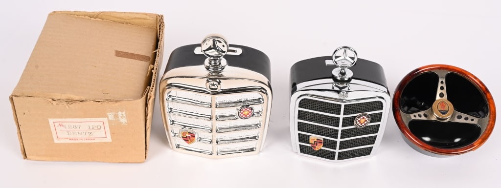 MERCEDES & MASERATI AUTOMOTIVE ITEMS: Lot includes Maserati Steering Wheel ashtray, Mercedes Benz Grill Cigarette Lighter by Royal of London and Mercedes Benz Grill Bank in original box. Largest is 5 1/2" excellent