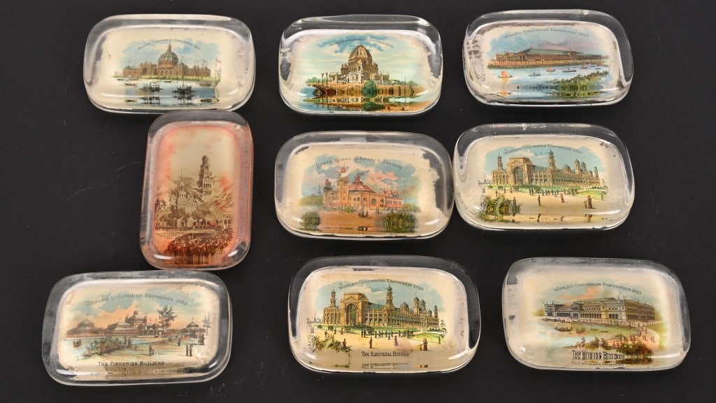 6 COLUMBIAN EXPOSITION PAPER WEIGHTS: Lot of 9 Columbian Exposition paper Weights. All colorful showing Buildings from the Worlds Fair. 4" Excellent