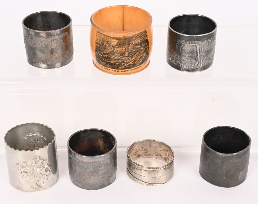 7 COLUMBIAN EXPOSITION NAPKIN RINGS (1 of 3)