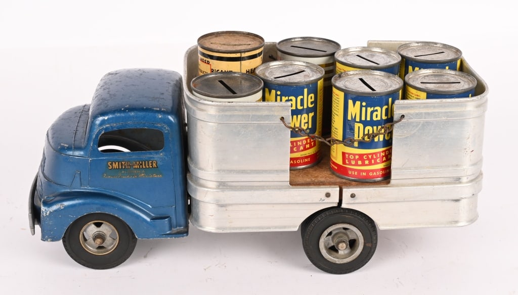 SMITH MILLER BARREL TRUCK w/ ADVERTISING BANKS: All original with decent paint and decals. Comes with 8 Advertising Tin Banks. 13 1/2" Very Good-Excellent