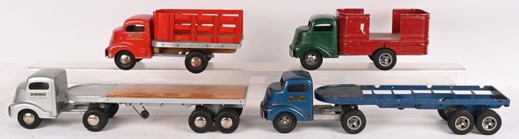 4- SMITH MILLER GMC TRUCKS: Includes Barrel Truck, Stake Bed Truck, and 2 Flat Bed Semi Truck. Conditions vary. Largest 23" AS-IS