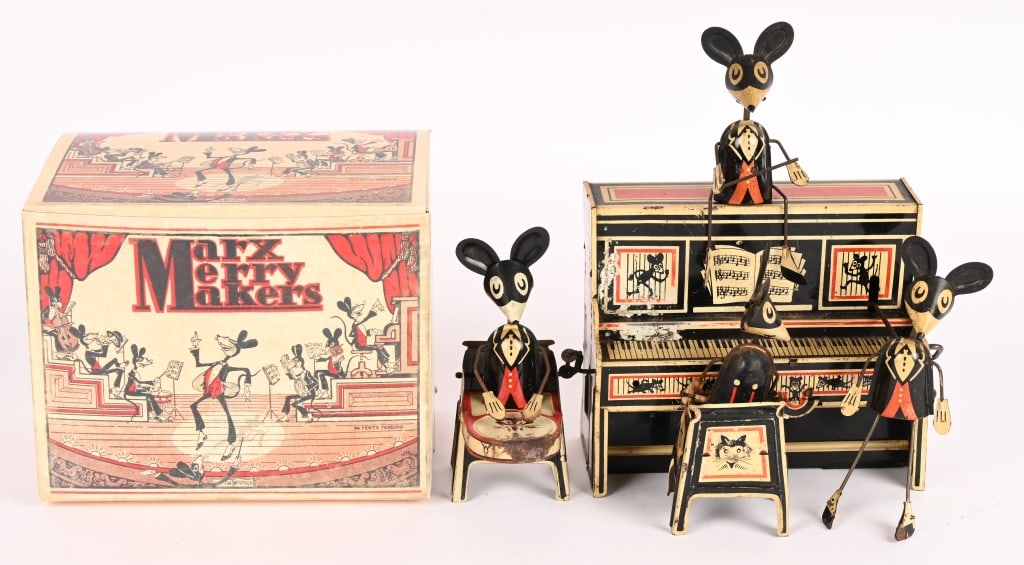 MARX TIN WINDUP MERRY MAKERS BAND: All original and complete. Has conductor mouse. Windup works. Comes with reproduction Box. 9" Excellent