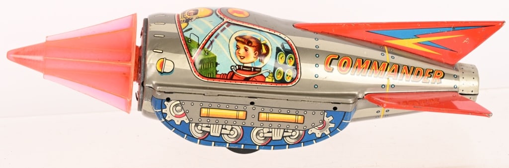 JAPAN TIN FRICTION SPACE COMMANDER: Great looking all original Spaceship. Very nice graphics and colors. Friction works. Has price stamp on bottom. 10" Excellent