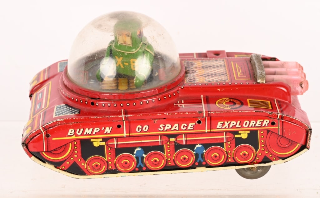JAPAN TIN FRICTION BUMP N' GO SPACE TANK: All original with great design. Has full body spaceman driver. Friction works. 6" Excellent
