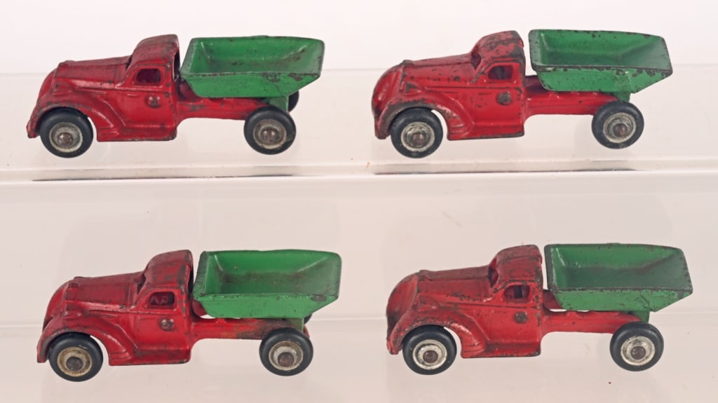 4- HUBLEY CAST IRON DUMP TRUCKS: All in original condition. Conditions vary. 4" AS-IS