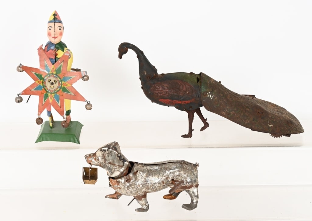 3- GERMAN & GIBBS TIN TOYS: Lot includes EBO Peacock, missing plume on head, working, Gunthermann Clown, repainted, not working. Litho umbrella is original, and Gunthermann Dachshund, no paint, not working. AS-IS