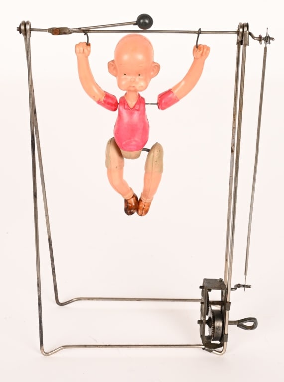 JAPAN WINDUP CELLULOID HENRY ON TRAPEZE: All original in great shape. Works. 9" Excellent