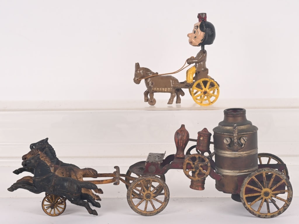 WILKINS HORSE DRAWN FIRE PUMPER & KENTON NODDER: Lot includes: 17" Wilkins transition cast iron and tin firepumper. All original and should clean up better. No cracks or repairs. Very Good, 2. 6" Kenton cast iron Happy Hooligan Nodder. Original toy 
