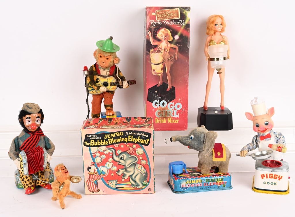 5- BATTERY OPERATED TOYS: Includes Go Go Girl, Bubble Blowing Elephant, Piggy Cook, Rock n Roll Monkey, and Clown & Monkey. All in original condition. AS-IS