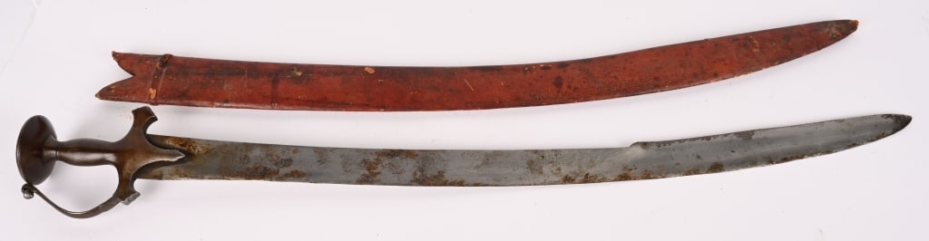 EARLY 19TH CENTURY INDIAN TALWAR SWORD W SCABBARD: Impressive Talwar iron disc hilt and knuckle bow, and a fullered blade. measuring 35 1/2 inches 30 1/2 inch curved blade. Comes with a red painted wood scabbard. Etymology and classification: The