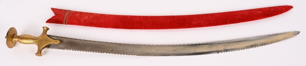 EARLY GOLD GILD INDIAN TALWAR SWORD W SCABBARD: Impressive Talwar gild disc hilt and knuckle bow, and a fullered blade sword, Comes with a wood scabbard covered in red velvet with accents. Excellent. Etymology and classification: The word talwar