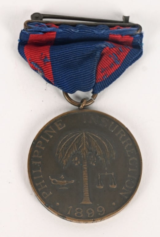 PHILIPPINE INSURRECTION MEDAL NUMBERED 2706 ARMY: Full wrap brooch Army campaign medal for the Philippine Insurrection. Numbered on the 6 o'clock position of the planchet, "No. 2706." Excellent . The Philippine Campaign Medal is a medal of the United