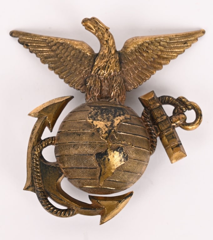 M1887/89 MARINE CORPS SUN HELMET EGA INSIGNIA: Marine Corps Model 1887/89 Spiked Sun Helmet EGA or Eagle Globe and Anchor being made of brass measuring 3 1/4 X 3 1/2 inches with a single screw post to the center of the globe. Excellent.
