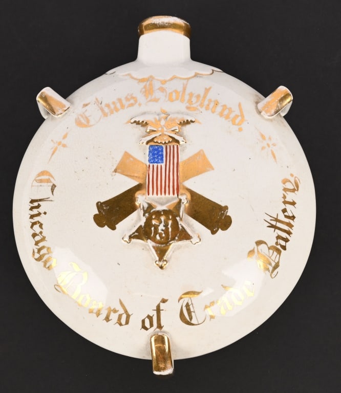 CIVIL WAR GAR PORCELAIN CANTEEN NAMED ARTILLERY: Attractive Civil War GAR Canteen, identified to Charles Holyland of the Chicago Board of Trade Independant Battery. Canteen measures 7 inches in diameter showing a gild cross artillery cannons with a 