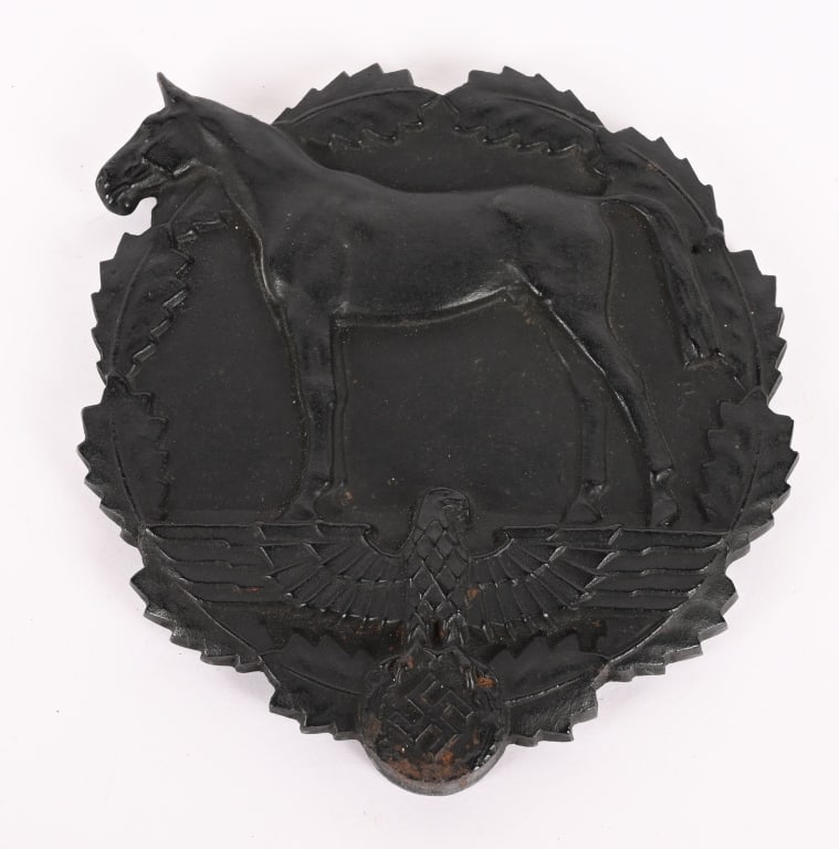 WWII NAZI GERMAN PLAQUE FOR DONATION OF HORSES WW2: A heavy, black iron award in the form of a 11cm diameter oak leaf wreath which, to the obverse, mostly encircles a profiled horse, standing atop a spread-winged eagle with a wreathed, mobile swastika