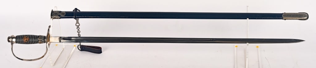 WWII NAZI GERMAN POLICE OFFICER SWORD BY EICKHORN: This Degen has bright nickel plating throughout its hilt. The “D” guard is type with the upper ferrule built in, and it flows nicely around through the crossguard to a teardrop quillon whi