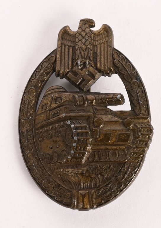 WWII NAZI GERMAN PANZER ASSAULT BADGE IN BRONZE: Nicely detailed, die stamped, hollow backed, alloy construction award with a bronze plate. The badge is in the form of an embossed, vertically oval, oak-leaf wreath with a Wehrmacht style eagle with d