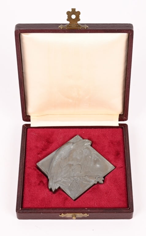 WWII CASED HITLER YOUTH NON-PORTABLE AWARD 1941: A Hitlerjugend Siegerplakette für Schwimmen im Etui 1941. It is constructed out of a die stamped zinc base that has been silver washed. The rhombus-shaped obverse features a closed winged eagle p