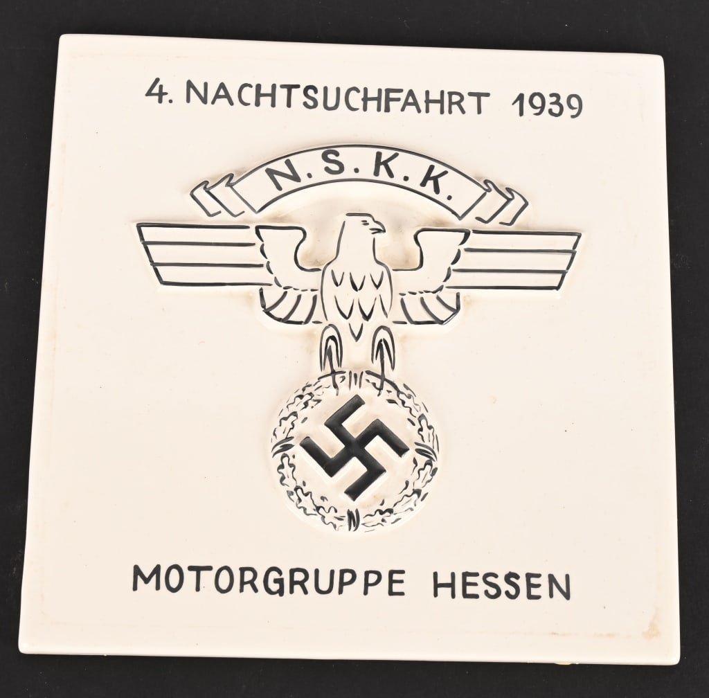 WWII NAZI GERMAN NSKK MOTORGRUPPE HESSEN TILE WW2: A very attractive tile measuring 6 X 6 inches that has a three dimensional insignia of the NSKK with the text 4. NACHTSUCHFAHRT 1939 MOTOGRUPPE HESSEN. Maker marked to the reverse WAECHTEERBACH German