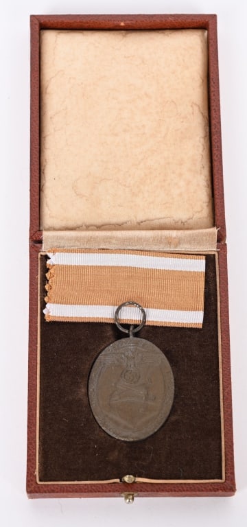 WWII NAZI GERMAN CASED WEST WALL MEDAL WW2: A West Wall Campaign Medal with Rare Case of Issue. A West Wall Campaign Medal with Rare Case of Issue - In bronze, 33.2 mm x 41.5 mm, mint. In rare case of issue, very fine. The West Wall Medal 