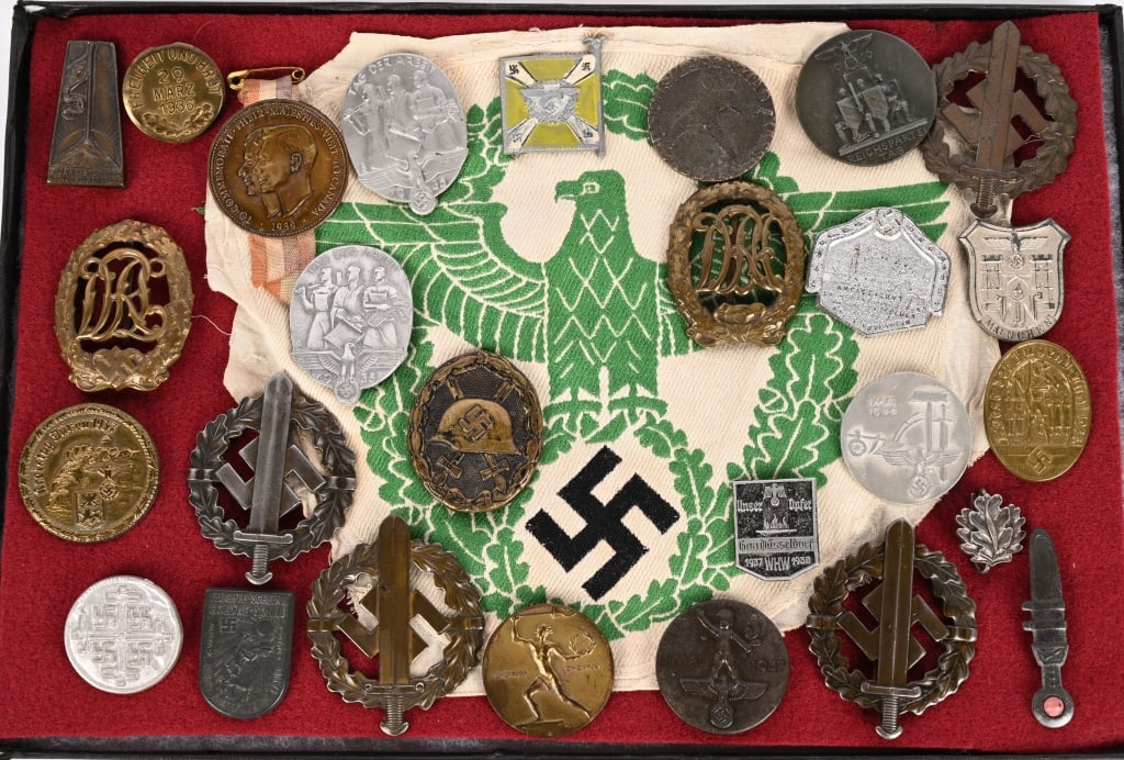 WWII NAZI GERMAN TINNIE & BADGE LOT POLICE SPORT: Lot of Nazi German Badges and insignia to include badges of the SA, two with broken pins, DRL badge and tinnies as well as a Police Cloth Sports Badge. Excellent. 