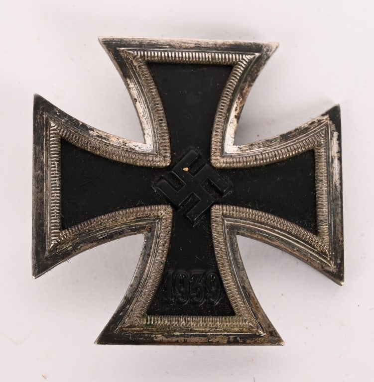 WWII NAZI GERMAN IRON CROSS 1st CLASS MKed 4 WW2: Slightly Vaulted, 1939 pattern, die struck, three piece, iron and alloy construction Pattée style cross with a single piece iron core and two piece alloy frame. The obverse of the award features 