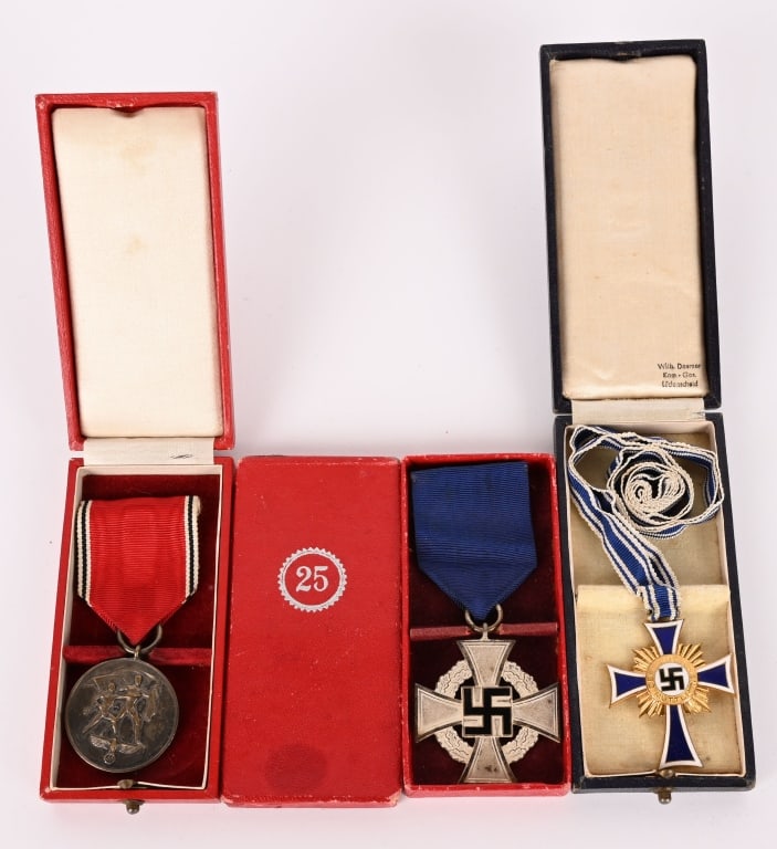 WWII NAZI GERMAN CASED MEDAL LOT NSDAP CROSS WW2: Lot of of WWII Nazi German Cased Medals to include 1) WWII NAZI GERMAN CASED MOTHERS CROSS IN GOLD WW2. A second pattern, two piece, die stamped tombak award with a fire gilted finish and blue and whi