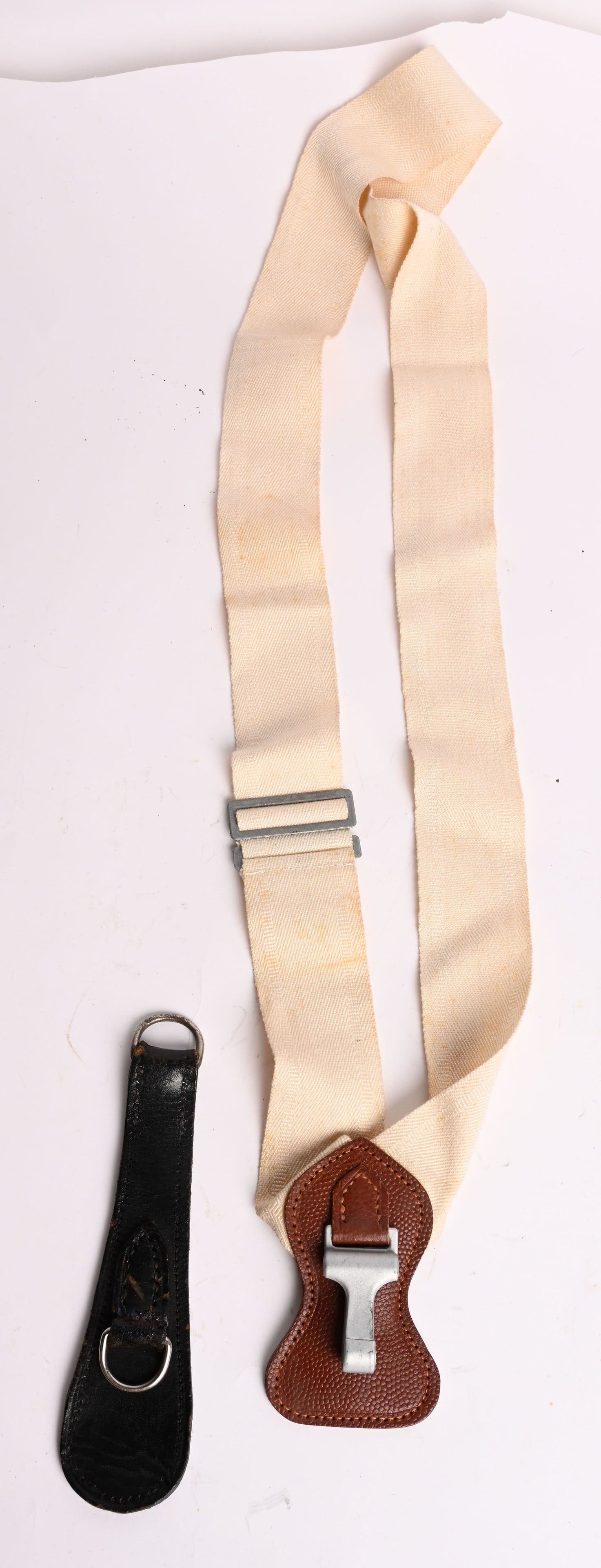 WWII NAZI GERMAN SWORD HANGER OVER THE SHOULDER: WWII Nazi German Edged Weapon Lot to include 1) OFFICER'S OVER THE SHOULDER SWORD HANGER. An over the shoulder sword hanger generally utilized by Officer ranks. All complete. The wear of sidearms, (ba