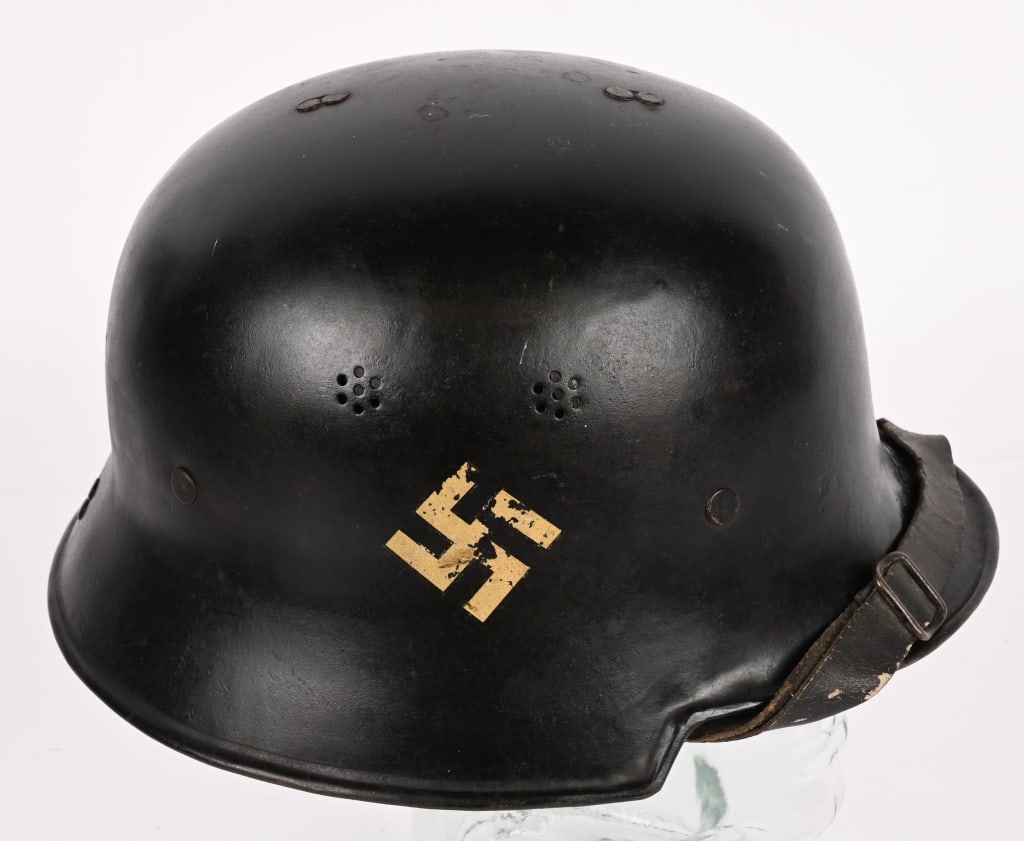WWII NAZI FEUERSCHUTZPOLIZEI DOUBLE DECAL HELMET: Early, light weight, stamped, aluminum alloy construction civic M34 "square dip" style helmet retains most of it’s original, black satin finish paint. The helmet has the third pattern insignia, 