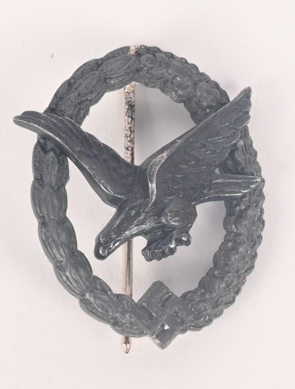 WWII NAZI GERMAN LUFTWAFFE AIR GUNNER'S BADGE WW2: Die struck alloy construction badge with silver wash. The badge is in the form of a nicely convexed, vertically oval wreath with laurel leaves to the left side and oak-leaves to the right side with a 