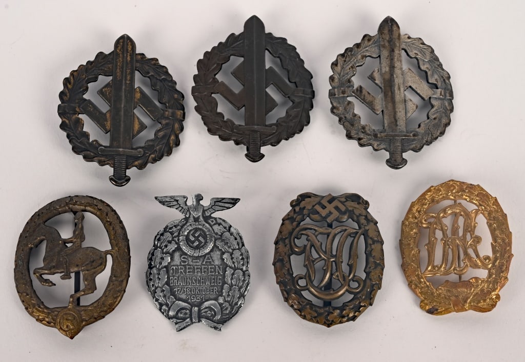 WWII NAZI GERMAN BADGE LOT SA NSDAP DRL DRA WW2: Lot of WWII Nazi German Medals to include 1) DRA SPORTS BADGE, BRONZE. Die struck, tombac, award in the form of an embossed, vertically oval, oak-leaf wreath with bow to bottom, encompassing the inter