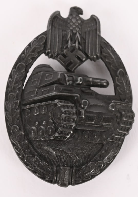 WWII NAZI PANZER ASSAULT BADGE IN BRONZE ASSMANN: Nicely detailed, die stamped, hollow backed, alloy (cupal) award with a bronze washed finish is in the form of an embossed, vertically oval, oak-leaf wreath with a Wehrmacht style eagle with down-swep