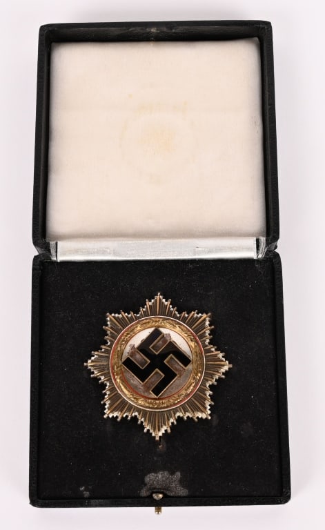 WWII NAZI GERMAN CASED GERMAN CROSS IN GOLD WW2: A very old copy of a German Cross. Five piece, slightly convexed, die struck, light (cupal) construction badge with black and red enamel work. The cross features a double, overlaid, eight point, sunbu