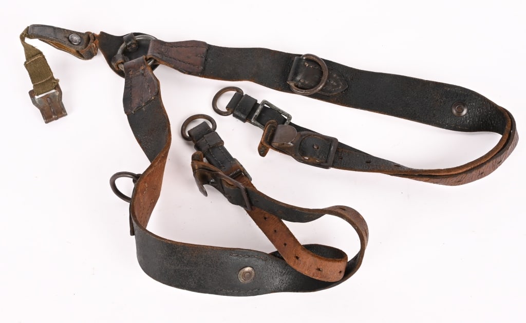 WWII NAZI GERMAN WEHRMACHT COMBAT Y-STRAPS WW2: Blackened leather construction combat pattern Y-straps. All buckles and hooks are present. Nicely Rb#ed 0/0896/0027. Excellent. The combat Y-straps were developed in April 1939 along with the M39 back