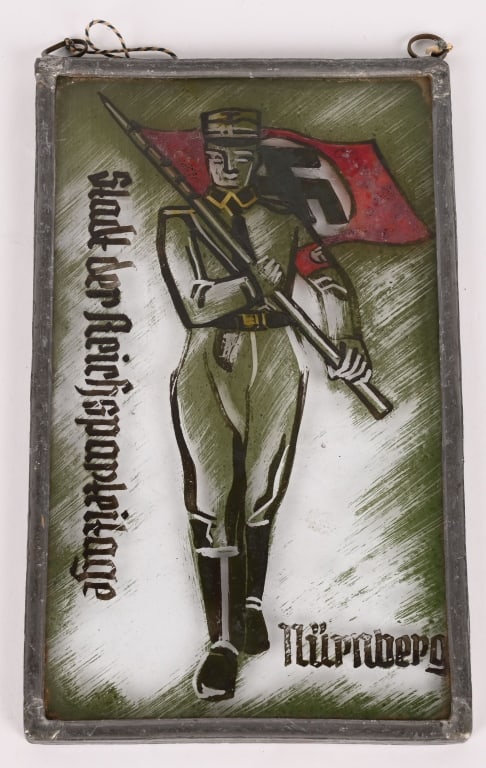 WWII NAZI GERMAN SA GLASS WINDOW HANGER WW2: Attractive small framed glass window hanger measuring 6 3/4 X 4 1/8 depicting an SA soldier holding a Nazi flag with the text Nürnberg Stadt der Reichsparteitage Nürnberg, the city of the Na