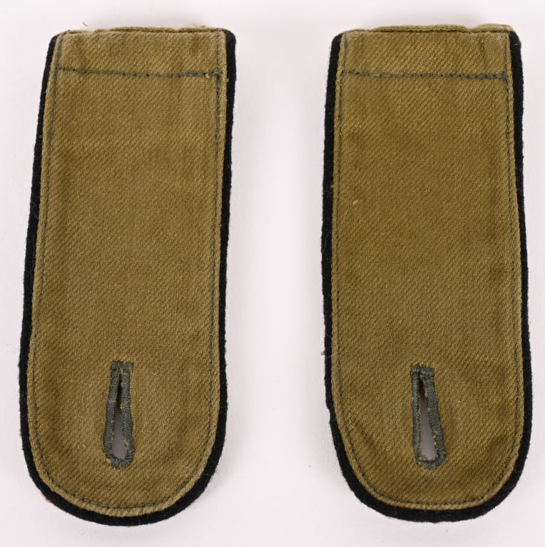 WWII NAZI GERMAN TROPICAL PIONEER SHOULDER BOARDS: Ribbed, olive/tan cotton construction slip on shoulder straps with black rayon waffenfarbe piping. The bottoms of the straps are in field-gray wool and the slip on retaining tongues are in ribbed oliv