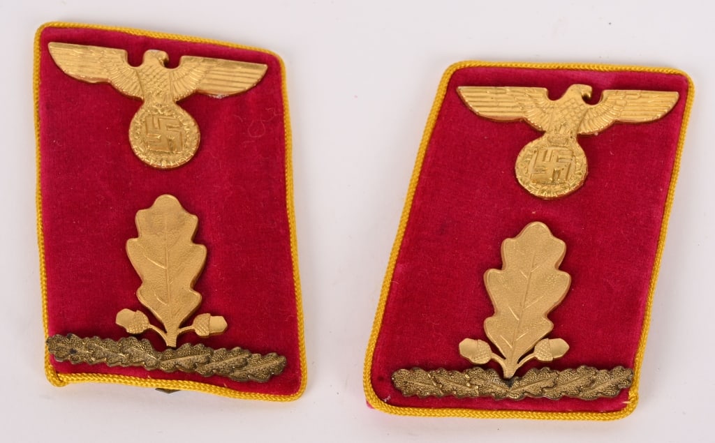 WWII NAZI NSDAP OBERABSCHITTSLEITER COLLAR TABS: NSDAP Reich-Abschnittsleiter collar tabs. Tabs are constructed on a red velvet base, with gold rayon piping. Approximate size is 70mm x 45mm. Collar tabs feature a gilt-washed national eagle, with a w