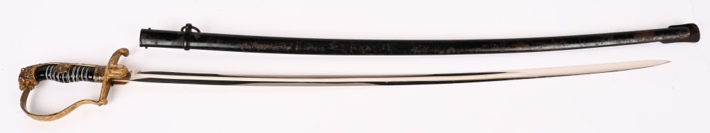 WWII NAZI GERMAN LION HEAD SWORD RED EYES EICKHORN: Nazi German Officers lion head sword with red eyes. Plain blade is in excellent condition. Grip and wire wrap intact. Overall length of the sword is 38" with a 32" blade. Scabbard retains 80%+ origina
