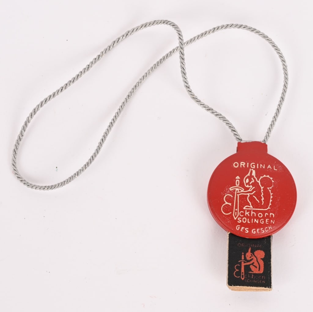 WWII CARL EICKHORN ISSUE SALES / CONTROL TAG WW2: These are rare! So even to find one in this condition is great! It is constructed out of a steel sheet metal base that has been die stamped and red and white enamel painted, which has been folded over