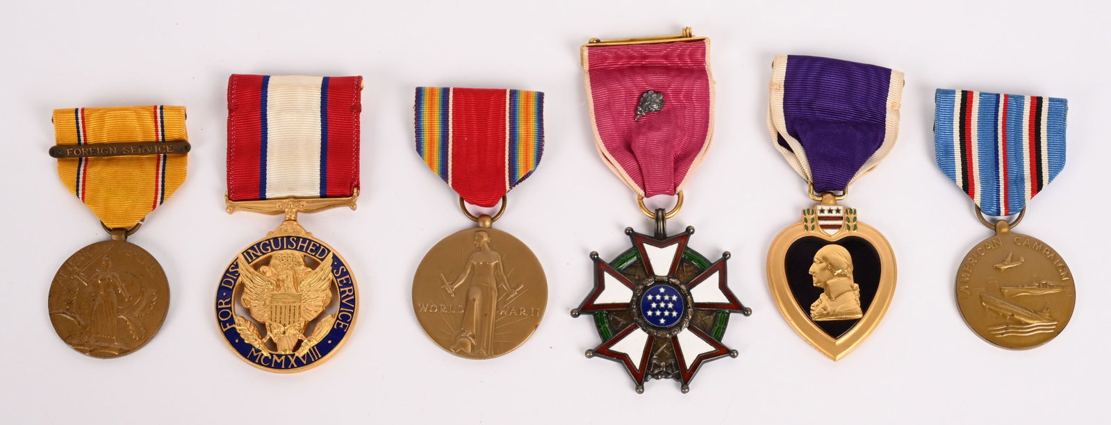 NAMED 4 STAR GENERAL MEDAL GROUP ROBERT J. WOOD: Named Medal Grouping of General Robert J. Wood to include Distinguished Service Medal Named to the reverse, Legion of Merit with oak leaf and numbered on the wrapped brooch 13651, Numbered Purpl