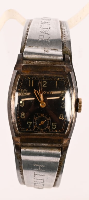 WWII NAMED BULOVA WRISTWATCH W JAPANESE PLANE BAND: WWII Bulova Wristwatch that is Private Purchased with a fantastic named Japanese Aircraft aluminum Wristband that is named to the soldier who sounineerd the piece. To the exterior is engraved South Pa