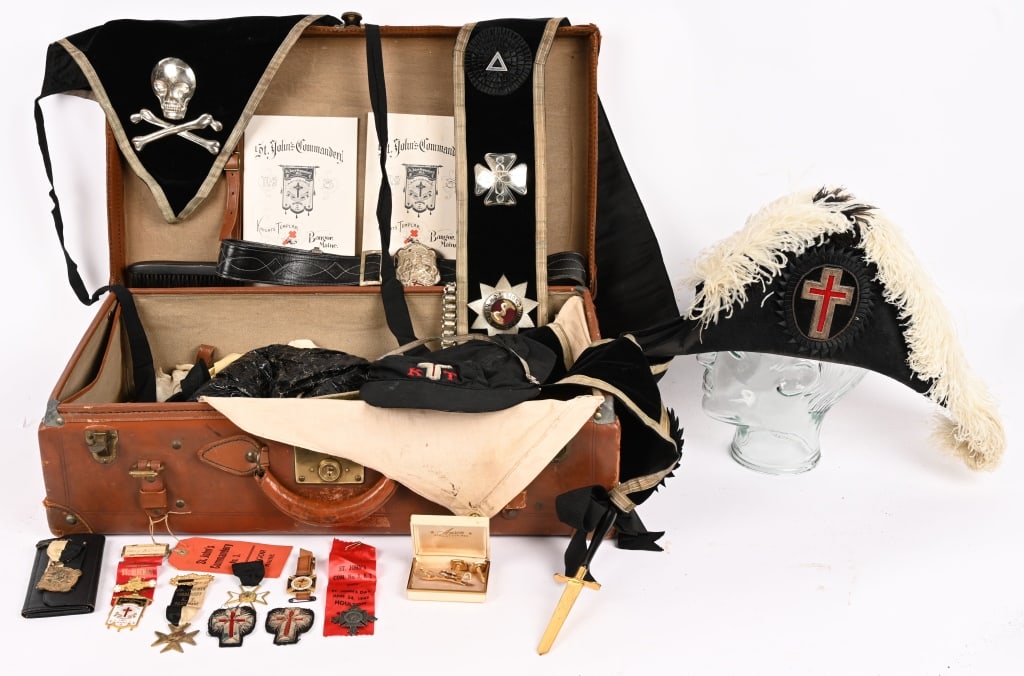 KNIGHTS TEMPLAR SASH BELT APRON INSIGNIA & MEDALS: Early Knights Templar trunk grouping to include 1) Fore and Aft Hat with Rain Cover size marked 7 1/4 2) Knights Templar Apron with metal Crossed Swords and Skull and Crossed Bones. 3) Knights Templar